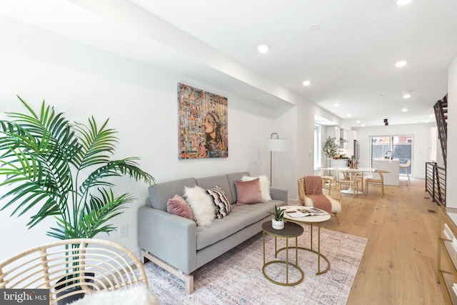 living room featuring light wood-style floors and recessed lighting