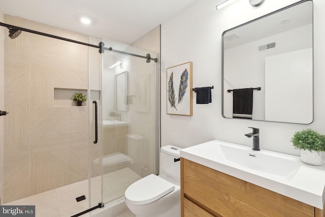 full bath featuring toilet, a shower stall, visible vents, and vanity