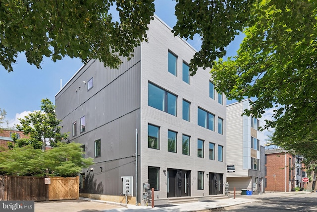 view of building exterior featuring fence