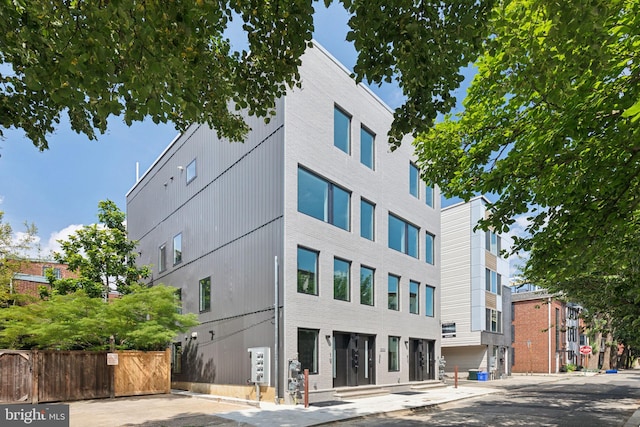 view of building exterior featuring fence