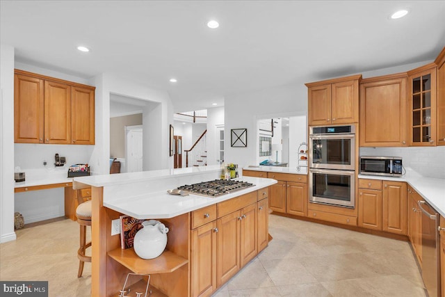 kitchen featuring recessed lighting, light countertops, appliances with stainless steel finishes, backsplash, and open shelves