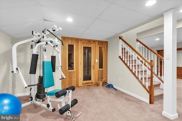 exercise area with carpet, baseboards, a drop ceiling, and recessed lighting