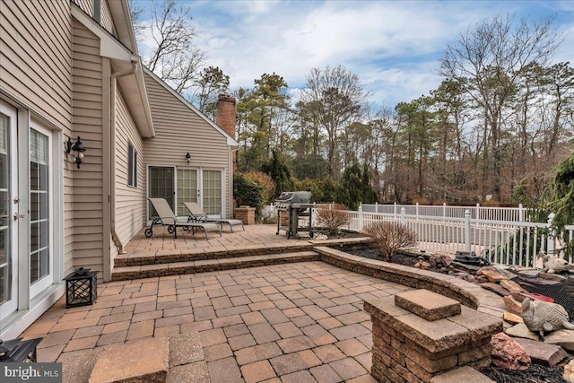 view of patio / terrace with area for grilling and a fenced backyard