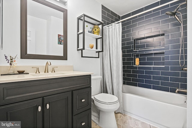 full bathroom featuring vanity, tile patterned floors, toilet, and shower / bath combo with shower curtain