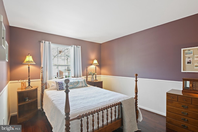 bedroom with hardwood / wood-style flooring