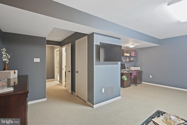 interior space featuring visible vents, baseboards, and carpet floors