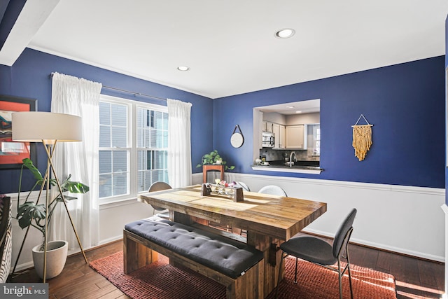 dining area featuring recessed lighting, baseboards, and hardwood / wood-style flooring