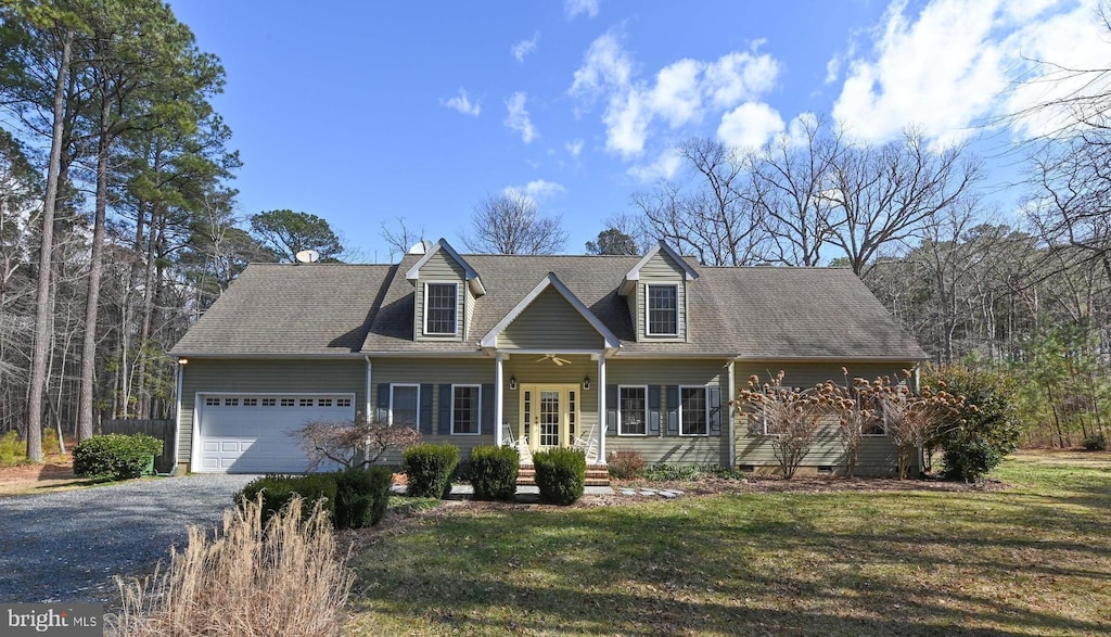 cape cod home with aphalt driveway, an attached garage, a front lawn, and crawl space