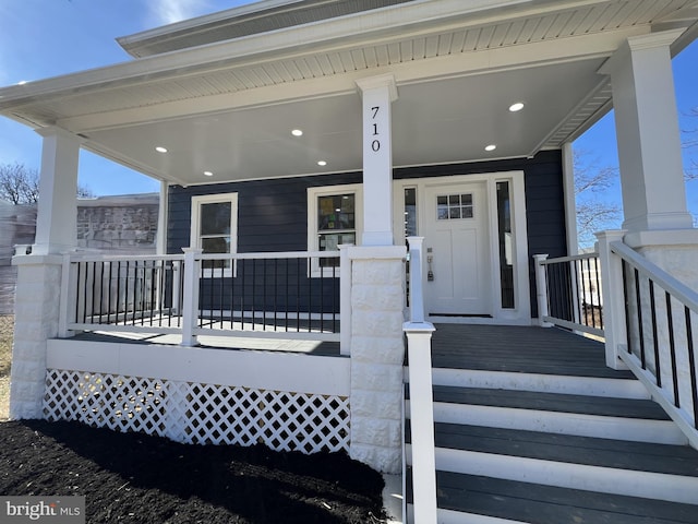 doorway to property with a porch