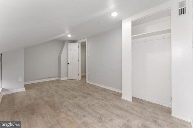 bonus room with light wood-style flooring, recessed lighting, visible vents, baseboards, and vaulted ceiling