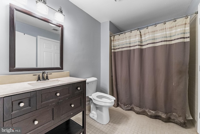 full bathroom with a shower with shower curtain, vanity, toilet, and tile patterned floors