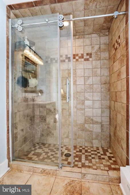 bathroom with a shower stall