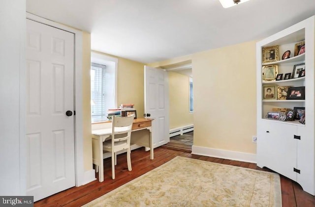 home office with baseboard heating, baseboards, and wood finished floors