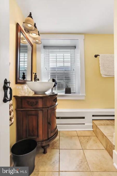 bathroom featuring tile patterned flooring and vanity