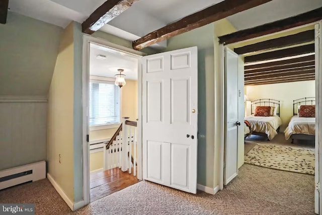 corridor with baseboards, an upstairs landing, beam ceiling, carpet flooring, and baseboard heating