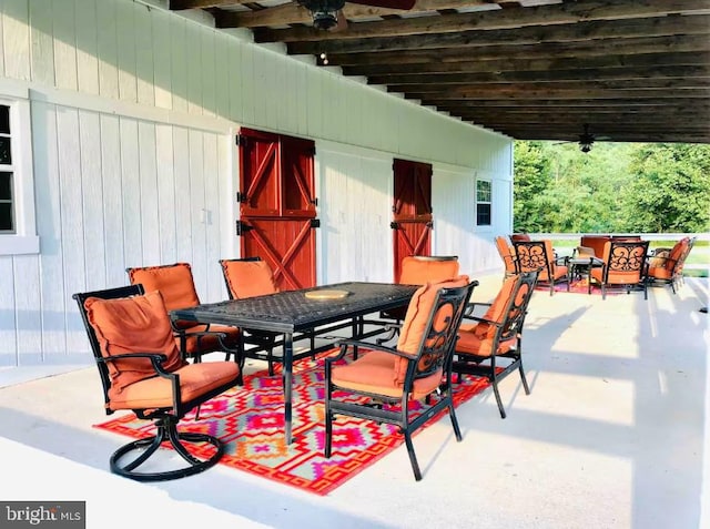 view of patio featuring outdoor dining area