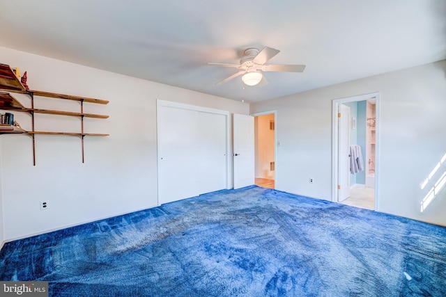 unfurnished bedroom featuring carpet flooring and a ceiling fan