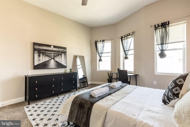 carpeted bedroom featuring ceiling fan and baseboards