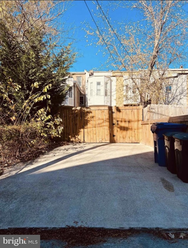 view of patio with a gate and fence