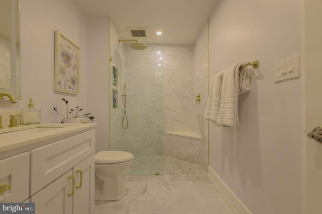 bathroom with a marble finish shower, visible vents, toilet, vanity, and baseboards