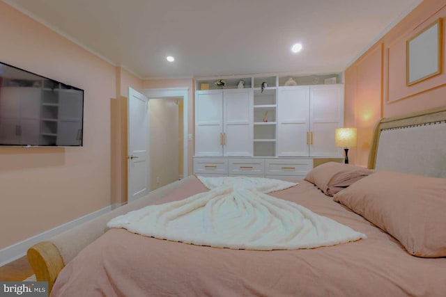 bedroom with baseboards, ornamental molding, and recessed lighting