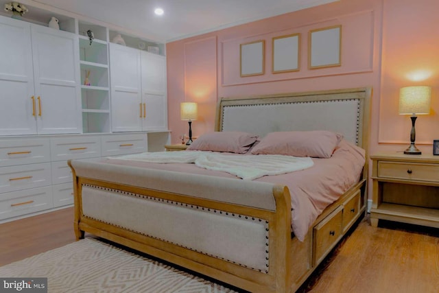 bedroom featuring recessed lighting and light wood-style flooring