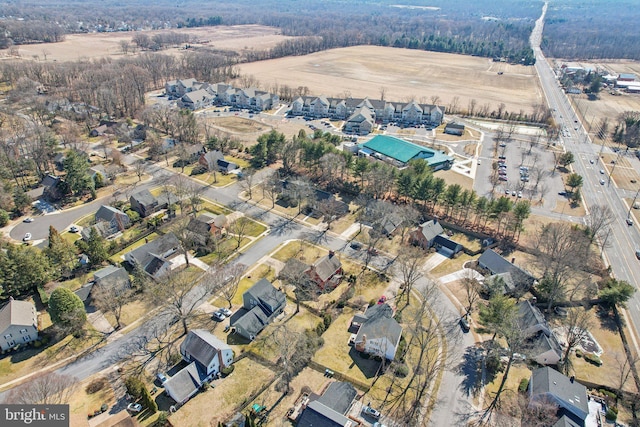 birds eye view of property with a residential view