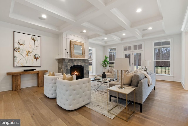 living room with light wood finished floors, coffered ceiling, beamed ceiling, a fireplace, and recessed lighting