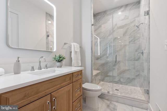 full bath with toilet, marble finish floor, a shower stall, and vanity