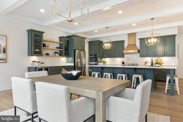 dining area with baseboards, beamed ceiling, an inviting chandelier, light wood-type flooring, and recessed lighting