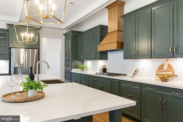 kitchen featuring a sink, custom range hood, stainless steel appliances, and green cabinetry