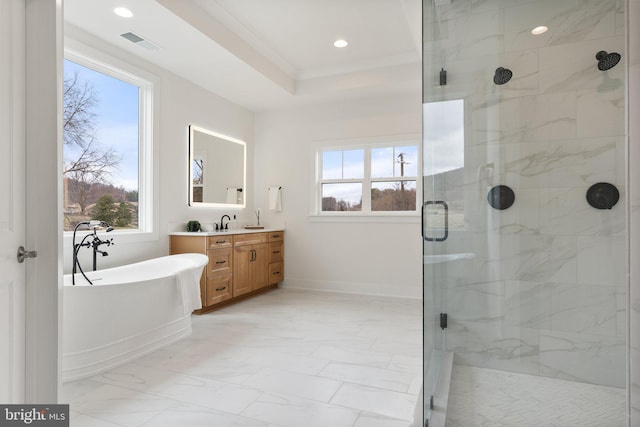 bathroom with visible vents, marble finish floor, vanity, a freestanding tub, and a shower stall