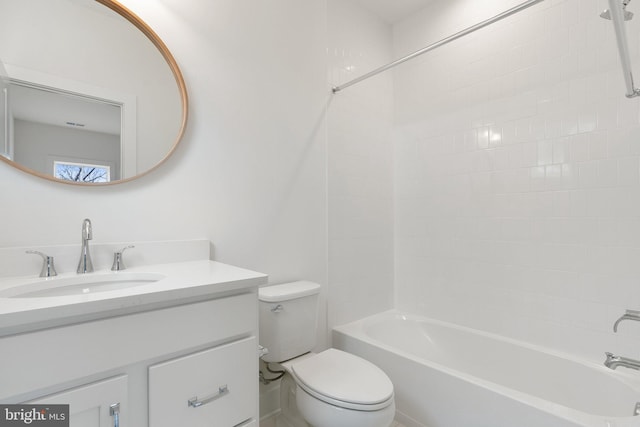 bathroom featuring shower / bathing tub combination, vanity, and toilet