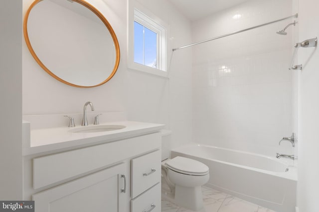 bathroom with marble finish floor, bathing tub / shower combination, vanity, and toilet