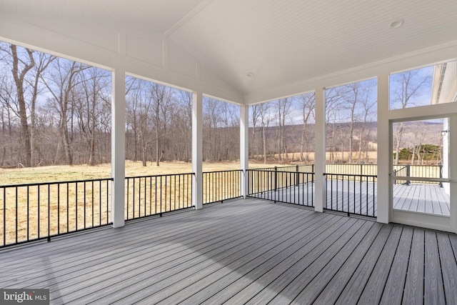 unfurnished sunroom with vaulted ceiling