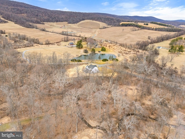 birds eye view of property featuring a rural view and a water and mountain view