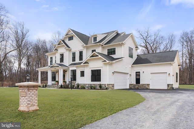 view of front of property with a garage, covered porch, driveway, roof with shingles, and a front lawn