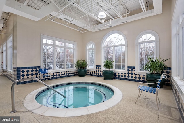 view of swimming pool featuring an indoor in ground hot tub