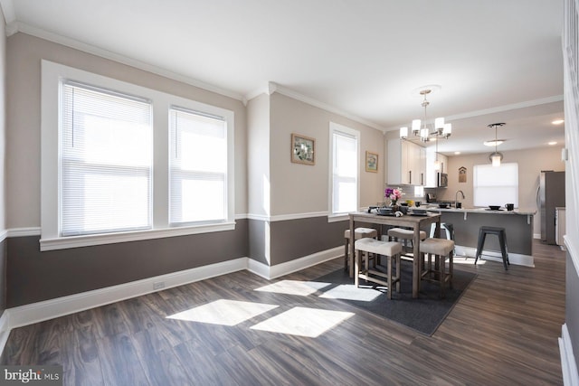 dining room featuring baseboards, an inviting chandelier, dark wood-style floors, and crown molding