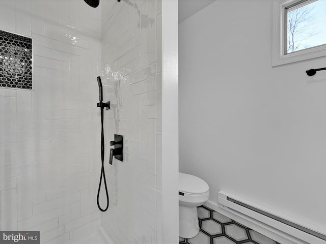 full bath with a baseboard radiator, a tile shower, and toilet