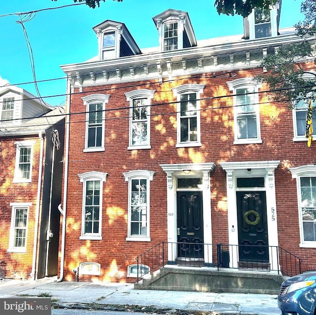 view of front of home with brick siding