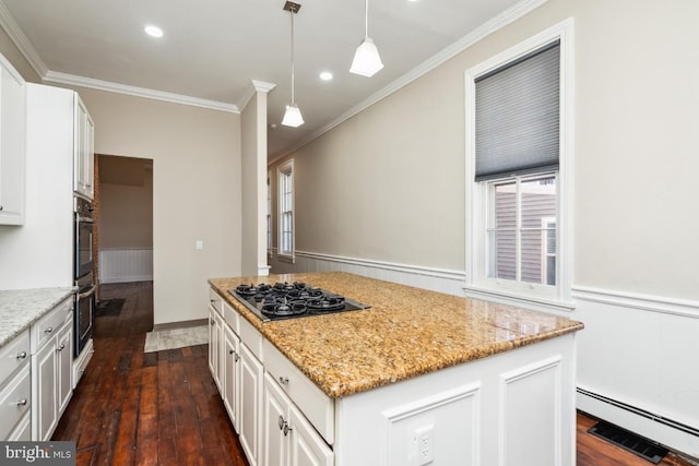 kitchen featuring a baseboard heating unit, dark wood-type flooring, black gas stovetop, and white cabinetry