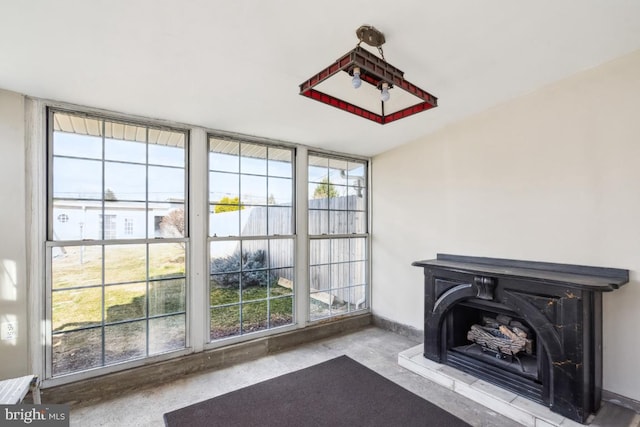 interior space featuring a wood stove and baseboards