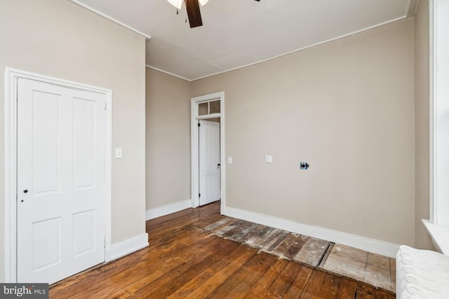 unfurnished room with a ceiling fan, hardwood / wood-style flooring, and baseboards