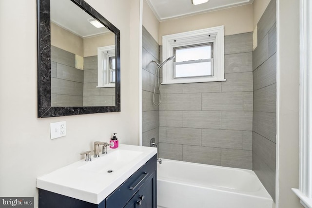 bathroom featuring washtub / shower combination and vanity