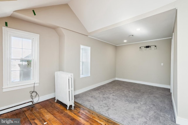 bonus room featuring baseboards, lofted ceiling, radiator heating unit, wood finished floors, and a baseboard heating unit