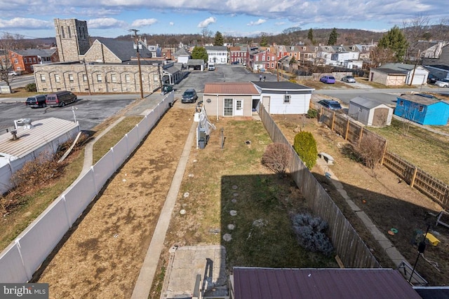 view of yard featuring a residential view and a fenced backyard