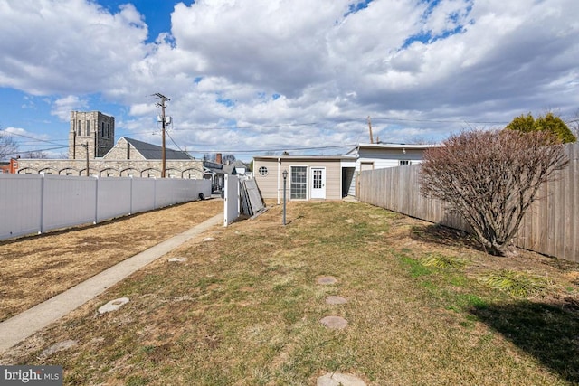 view of yard with a fenced backyard