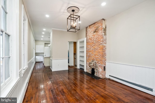 unfurnished living room featuring a chandelier, recessed lighting, a baseboard heating unit, a wainscoted wall, and dark wood-type flooring