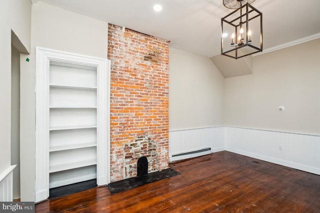 unfurnished living room featuring a baseboard heating unit, wainscoting, wood-type flooring, and built in features